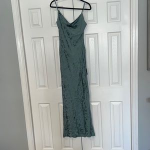 Never worn, with tags, sage green evening gown with slit.